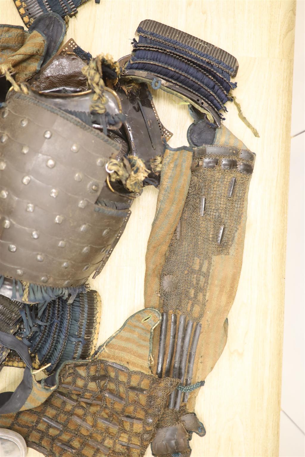 A Japanese iron armour Okegawa-do (Yoko-Hagi-horizontal make) 17th or 18th century, iron laminated breast and back plates with